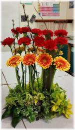 Carnation, Gerbera & Pussy Willow. The base was garden foliage in groups on a floral foam brick.