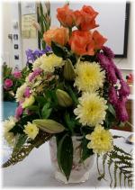 Flowers: Peach roses, lemon & lilac Chrysanth & Lily. ~~~ Container: Ceramic cachepot (urn type planter). ~~~ Style: Pyamid