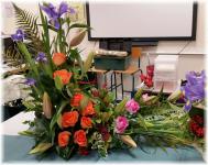 Flowers: Peach & Pink Roses, Iris & Pink Lily. ~~~ Style: Triangle with elongated horizontal